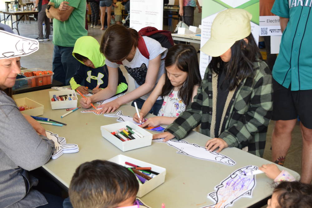 Children coloring at a booth at EarthFest 2024.