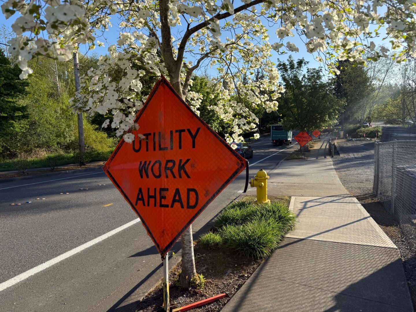 utility work sign next to road