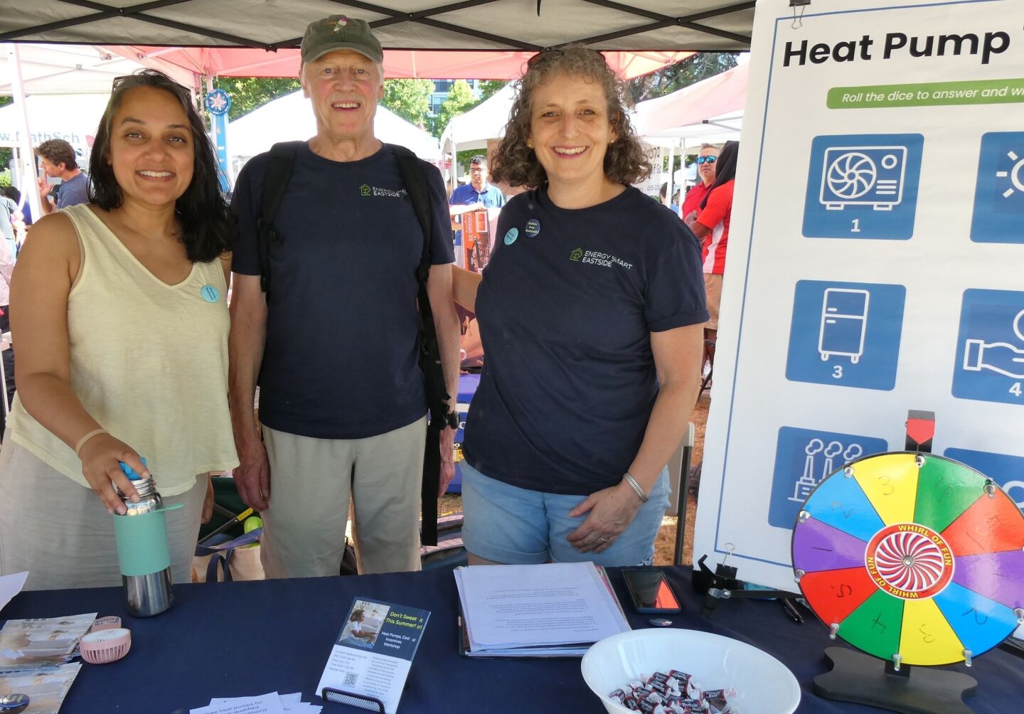 Energy Smart Eastside volunteers working at an informational table during an event