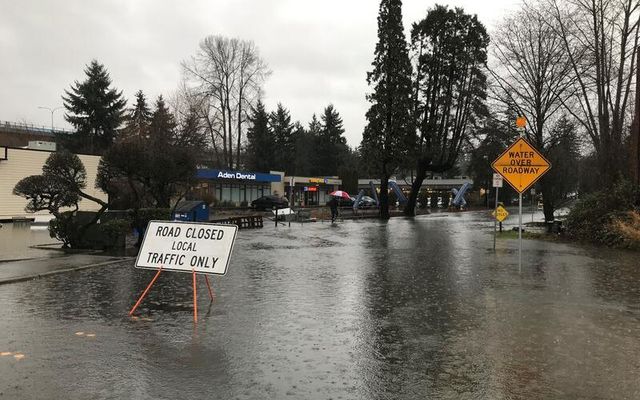 Water over roadway and closure signs