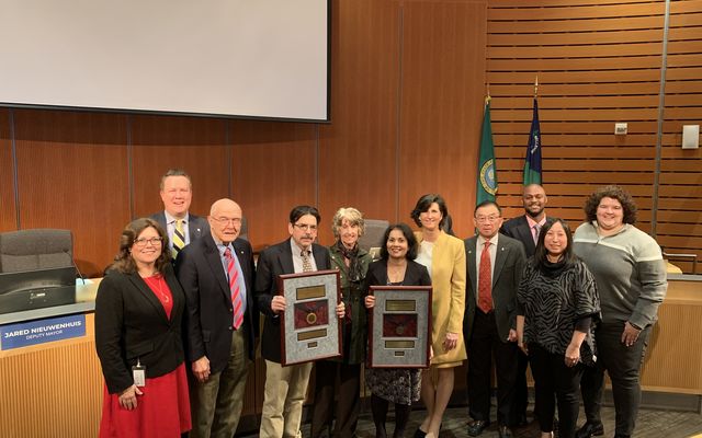 Bellevue Transportation and Utilities departments receiving re-accreditation plaques