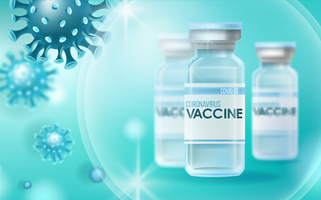Image of coronavirus with vaccine bottles in the foreground