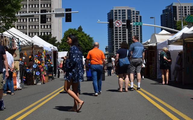 People peruse the offerings at the 6th Street Arts Fair in 2019.