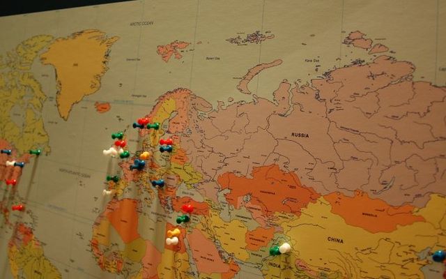 Push pins on various locations around the world