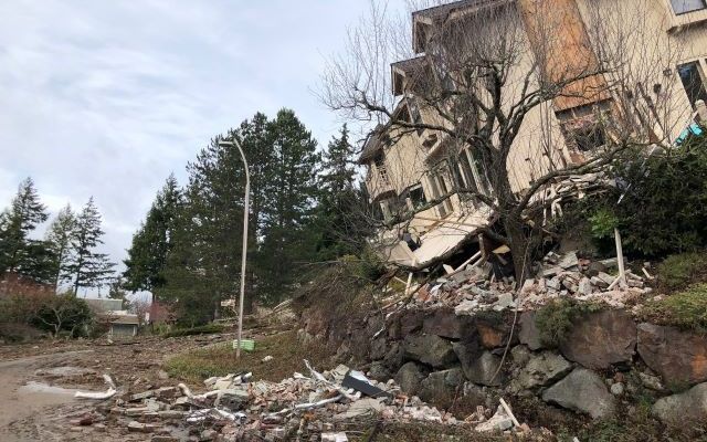 Home impacted by landslide
