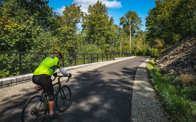 A cyclist rides Eastrail, which traverses Wilburton.