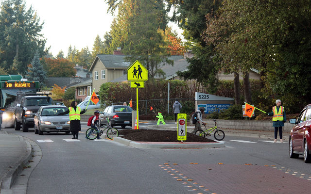 Newport Heights Elementary students use a crosswalk on the way to school.