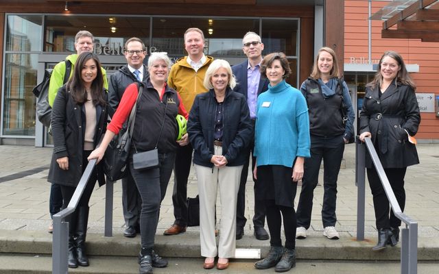 NTSB chair Jennifer Homendy (front row, second from right) takes a walking tour of Bellevue with Mayor Lynne Robinson (right, front row) and County Commissioner Claudia Balducci (second from left, front row).