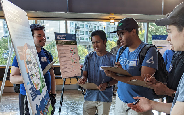 Residents participate in a housing forum at City Hall.