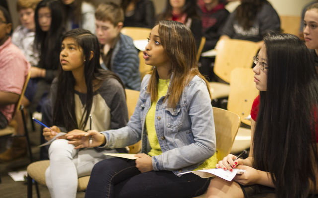 A girl speaks at a Youth Involvement Conference hosted by Bellevue Youth Link. Michael Kleven Photography