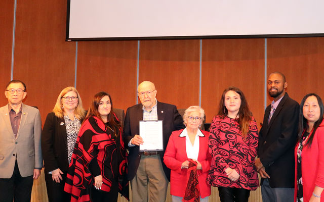 Duwamish Tribal Council Chairwoman Cecile Hansen, fifth from left, accepts the proclamation. Desiree Fagan (third from left) and Cindy Williams (third from right), are also on the Duwamish Council.