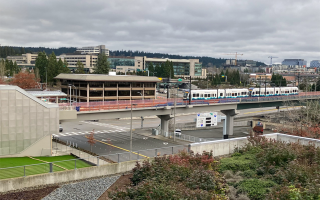 A light rail train on a practice run approaches the Downtown station.