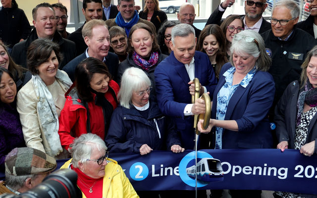 Elected officials from Bellevue, King County and the state cut the ribbon at the opening of Eastside light rail.