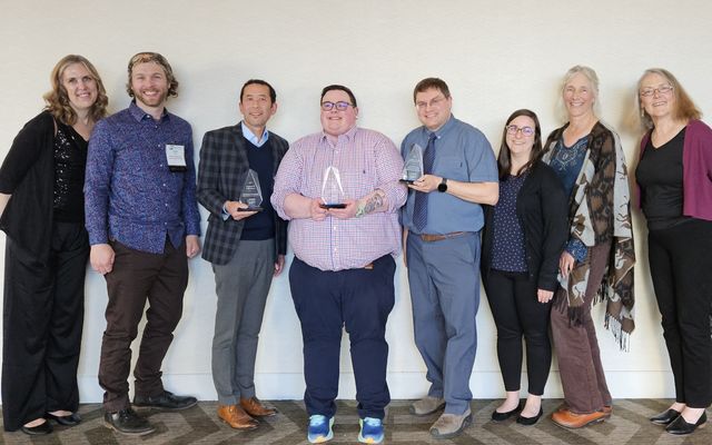 Parks & Community Services staff pose with WRPA awards.