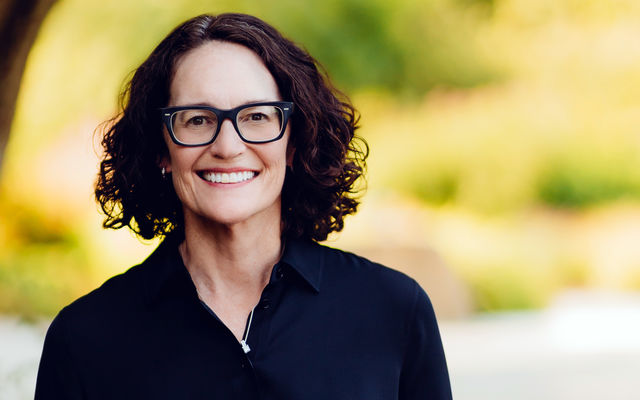 Image of Diane Carlson standing by a Bellevue street