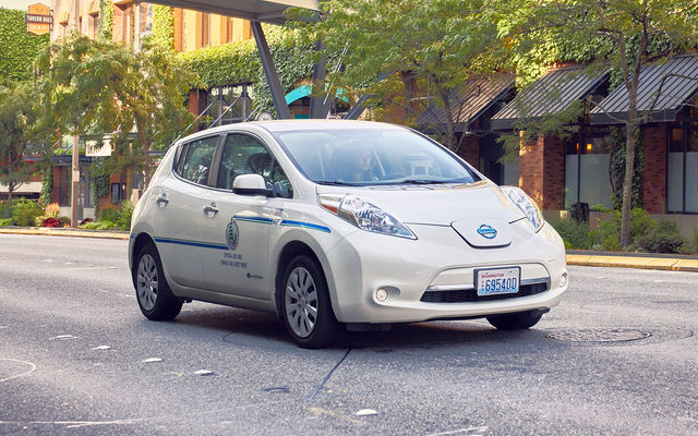 The city's fleet includes many electric vehicles like this Nissan Leaf riding on a Bellevue street.