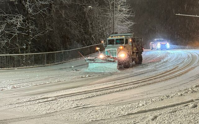 Snowplows clear snow from Bellevue streets.