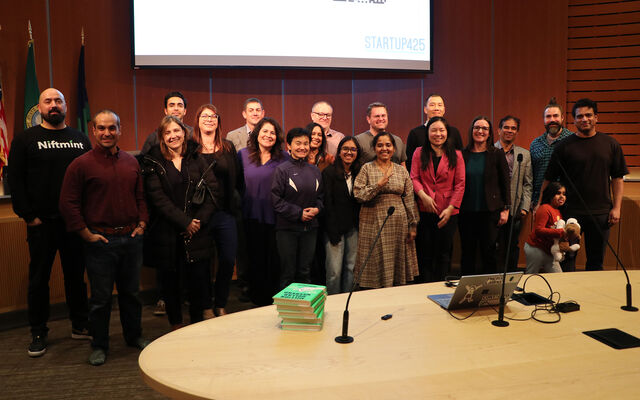 The first Startup 425 Accelerator cohort to graduate poses at City Hall, in the council chamber.