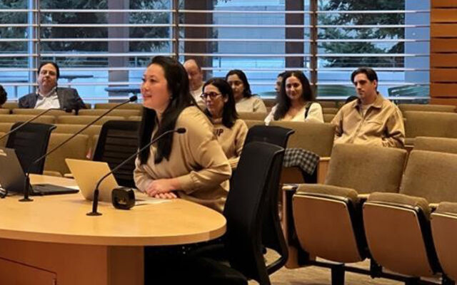 Claire Sumadiwirya answers questions from the council.