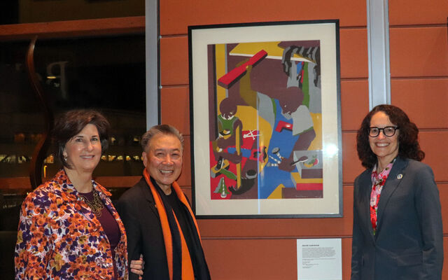 From left, Mayor Lynne Robinson, Jerry Lee and City Manager Diane Carlson stand next to the Jacob Lawrence artwork that Lee donated to the city.