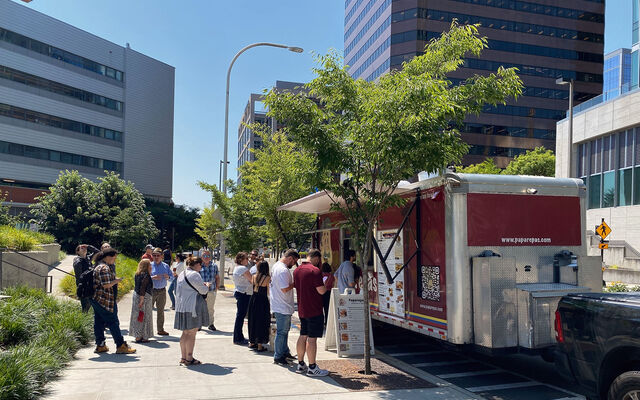 People line up by City Hall for the Paparepas food truck.