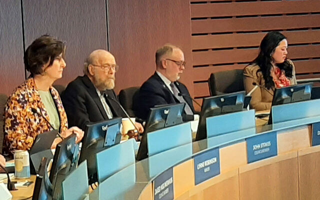 Councilmember John Stokes, second from left, announces his resignation while on the dais with Mayor Robinson, left, Councilmember Dave Hamilton, third from left and Councilmember Claire Sumadiwirya, right.