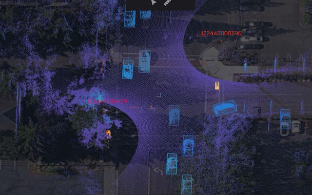 Sample LIDAR image of a street, with light blue shapes being cars.