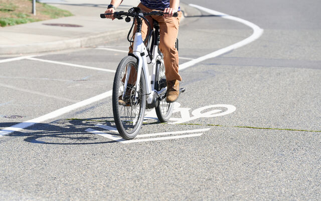 A person riding an electric bike. 