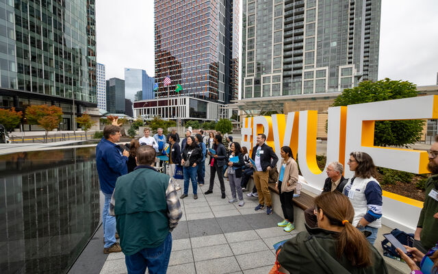 Bellevue Essentials participants are gathered at the City Hall plaza.