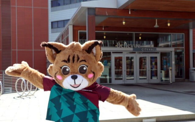 Belle the Bobcat, the city mascot, stands in front of City Hall.
