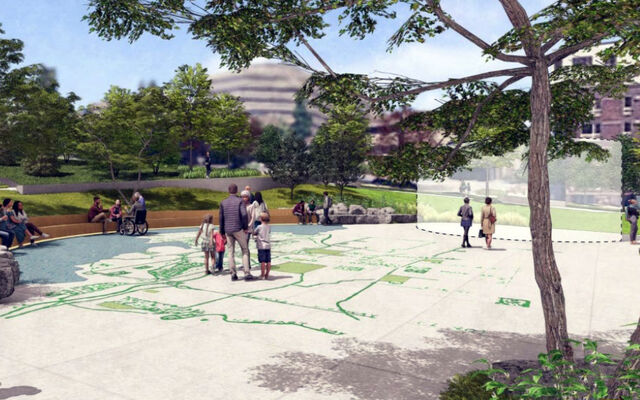 In a visualization created by MIG, people stand at a park, with a space marked where a monument would be.