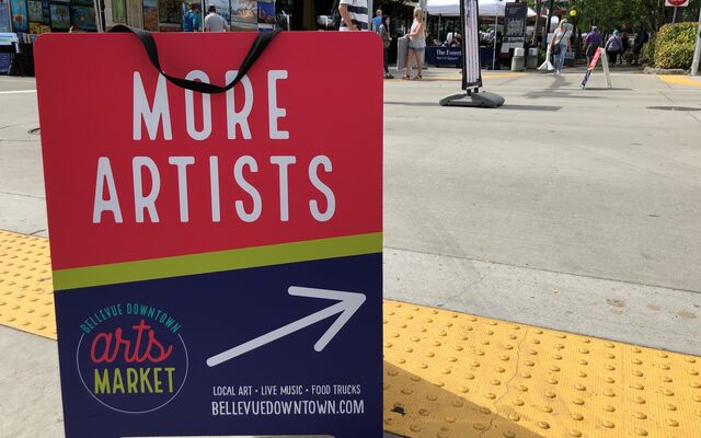 The rewritten sign code covers temporary signs as well, like this sandwich board calling for artists at the downtown arts market.