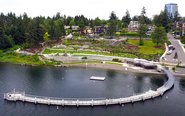The beach and pier of Meydenbauer Bay Park seen from above, with downtown Bellevue behind them.