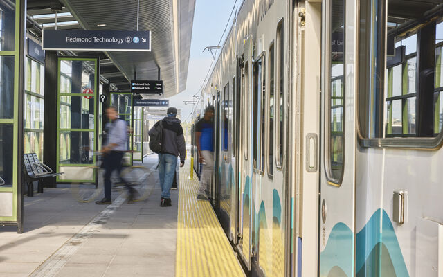People board the 2 Line at the 130th Street station.