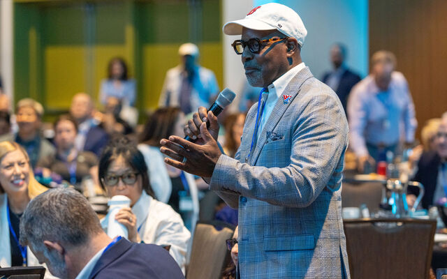 A gentleman speaks at an event.