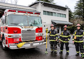 Firefighters stand in front of Station 9. PNW Thinline Photography