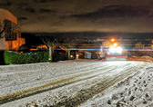A snowplow clears a neighborhood street in South Bellevue.