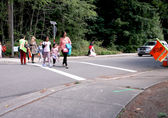 Students use a crosswalk improved via the Neighborhood Enhancement Program.