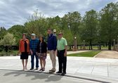 Councilmembers in front of Downtown Park's NE Gateway entrance