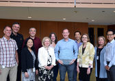 Bellevue's Leadership Team poses at City Hall with the What Works Cities plaque.