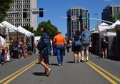 People peruse the offerings at the 6th Street Arts Fair in 2019.