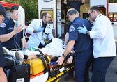 Bellevue paramedics treat a patient outside the ambulance.
