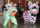 Lion dancers perform at City Hall. Lion  and dragon dancers are often part of the Lunar New Year celebration.