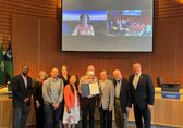 The City Council poses with folks accepting the proclamation for Pride Month.