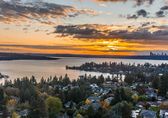 Aerial view of neighborhood, lake and Bellevue skyline.