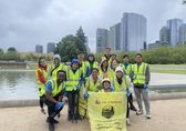 Volunteers with Visa do a clean-up at Downtown Park.