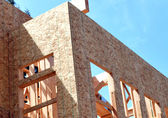 Image of residential construction on a sunny day.