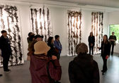 A group of people visit the Yuan Ru Gallery in BelRed.