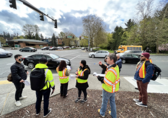 Staff and residents consider potential street design hazards during a road safety assessment.