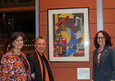 From left, Mayor Lynne Robinson, Jerry Lee and City Manager Diane Carlson stand next to the Jacob Lawrence artwork that Lee donated to the city.